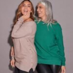 SWEATER CON BOTONES A LOS LADOS